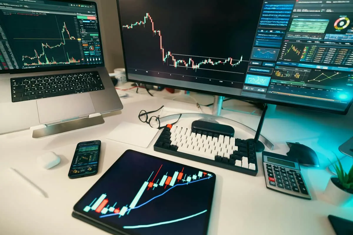 Stock charts displayed on multiple screens